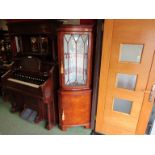 A Bevan Funnell burr walnut veneered reproduction glazed top corner cabinet,