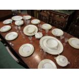 A Soho pottery Ambassador ware dinner service with cream border and floral spray detail,