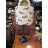 A table lamp with Dachshund design shade,