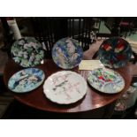 Five Wedgwood bird plates and a Royal Worcester limited edition Dorothy Doughty bird plate with