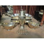 Two plated entree dishes, sugar caster, sauce boats,