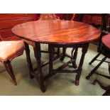 Circa 1760 an oak and elm circular drop leaf gate-leg table on turned legs and outswept feet with