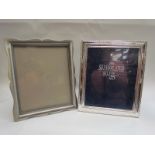 A silver plated and lacquered photo frame and another