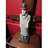 A painted wooden figure of a city gentleman,