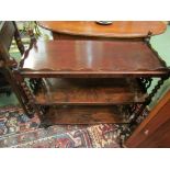 A William IV rosewood three tier etagere the three quarter raised gallery on turned supports and