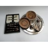 A selection of plated items including wine coasters, lobster set,