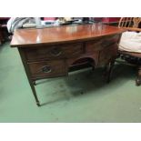 An Edwardian mahogany bow front sideboard, two over two drawers, tapering legs to spade feet,