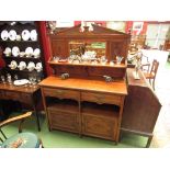 A late Victorian mahogany mirror back sideboard, two drawers over cupboard doors with alcoves,