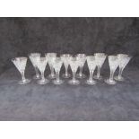 A suite of twelve (6+6) mid-century crystal glass wines profusely cut with diamonds,