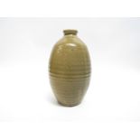 A Japanese studio pottery wheel thrown vase with olive glaze.