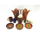 A collection of Hornsea Pottery including two coffee pots, mugs and dishes.