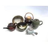 Six items of studio pottery including three teapots, cork lidded canister and two bowls. Tallest 19.