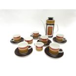 A 1970's J&G Meakin coffee service, geometric pattern in tan, ochre and brown.