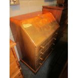 A modern veneered fall front bureau with four drawers on bracket feet