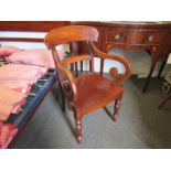 A Victorian mahogany elbow chair, scroll arms,