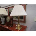 A modern brass table lamp with fluted column,