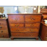 A Georgian mahogany secretaire with two faux drawers revealing drop flap with fitted drawer and