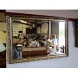 A gilt framed wall mirror with bevelled glass