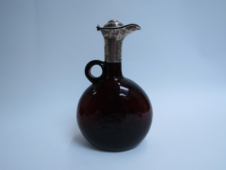 A 19th Century onion bottle claret jug inscription to neck, hairline crack to interior,