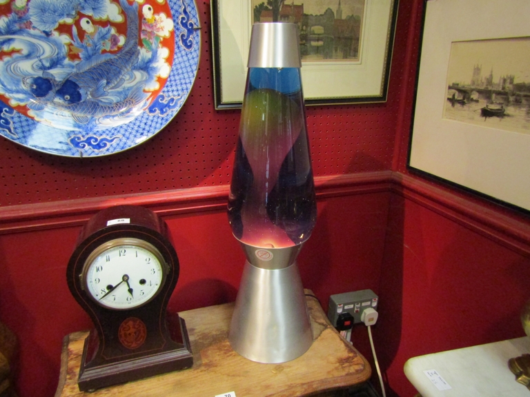 A large brushed steel lava lamp.