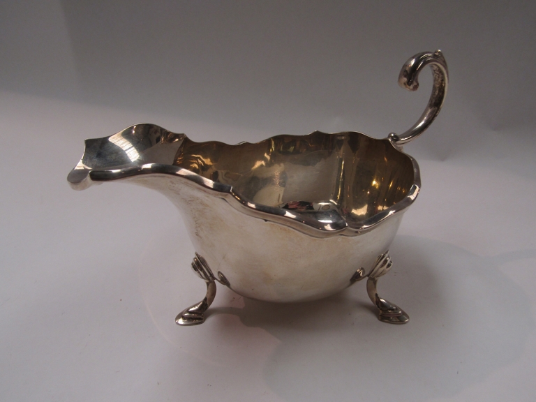 A large silver sauce boat marked Birmingham