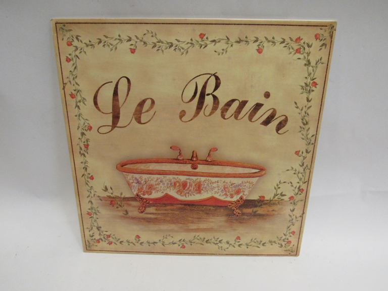 A metal sign "Le Bain" depicting roll top bath