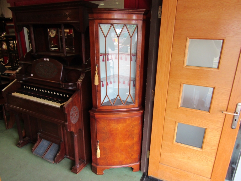 A Bevan Funnell burr walnut veneered reproduction glazed top corner cabinet,