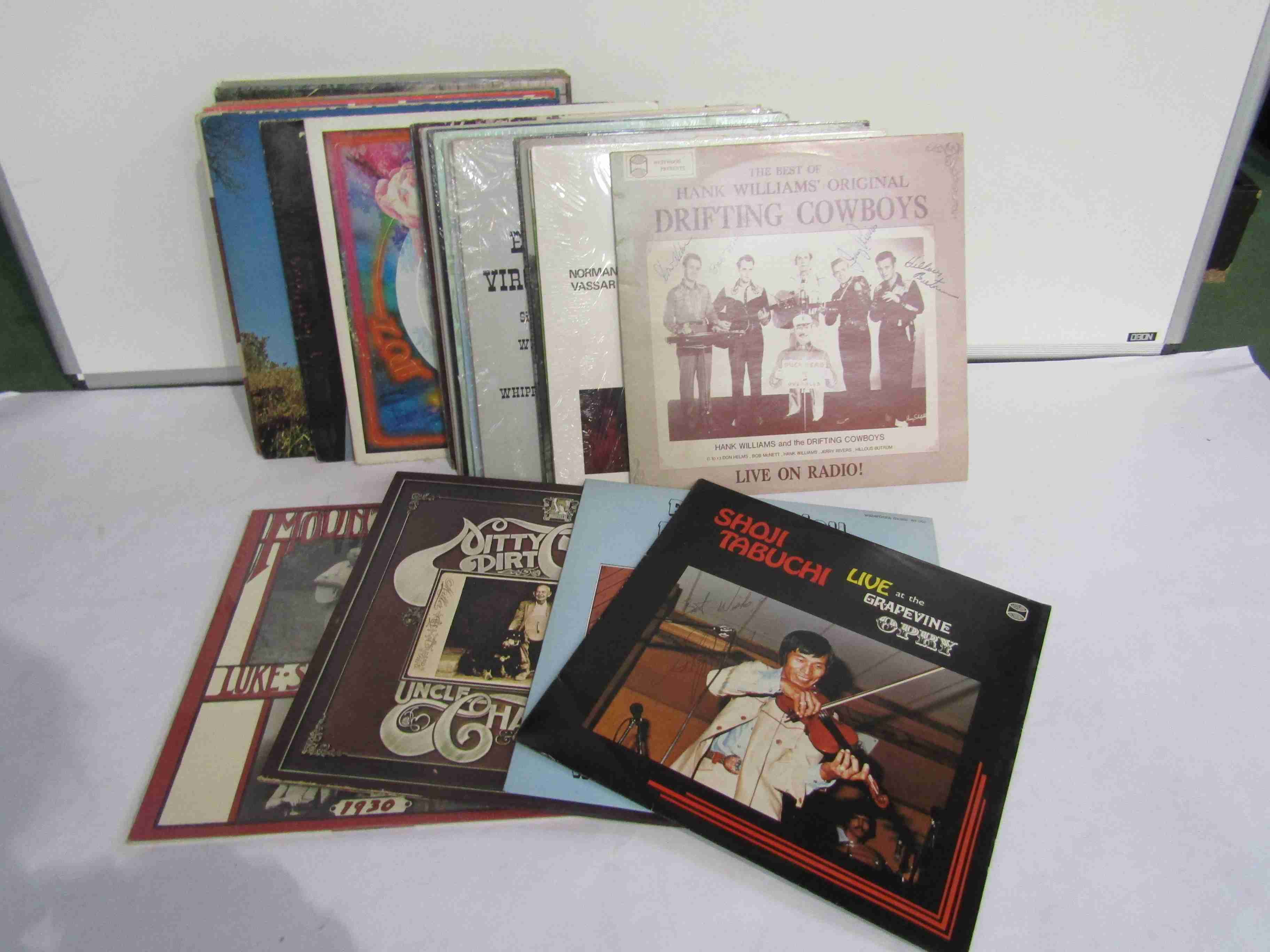 Thirty five assorted Country and Bluegrass LP's including Hank Williams and The Drifting Cowboys,