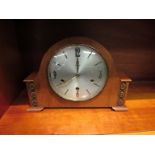 A 1950's walnut cased Smith's striking and chiming mantel clock with floating balance