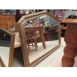 A modern gilt framed leaf design overmantel mirror with arched top,