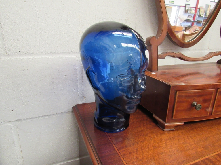 A blue glass head