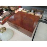 A 19th Century mahogany box of shallow rectangular form with hinged lid