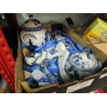 a box containing a selection of blue and white ceramics including figure, vases,