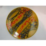 A Poole dish in yellow, orange and grey tones,