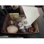 Two boxes containing assorted ceramics and glassware including three lamps and shades