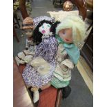 Two fabric dolls and a china headed doll
