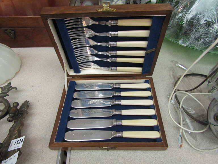 A cased EPNS knife and fork six piece set, scout badges, fishing reels, - Image 2 of 2