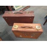 Two vintage leather suitcases