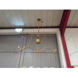 A Victorian brass rise-and-fall ceiling lamp