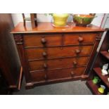A mahogany two over three chest of drawers on plinth base,