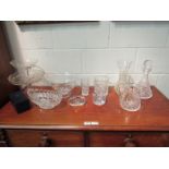 A collection of cut glass wares including tazzas, bowls, decanter, jug, timepiece,