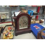 A mahogany bracket clock in the Georgian style with silvered face inscribed 'Biggs & Sons,