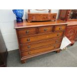 A modern Georgian style chest of six drawers, three short over three long,
