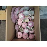 A box of 19th Century pink ground souvenir ceramics,