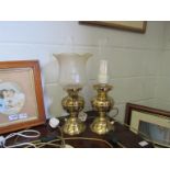 Two brass based electric oil lamps (one missing a shade)