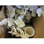 A box containing assorted vases and faux orchids