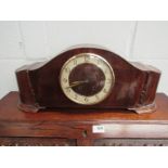 A 1950's oak and walnut striking mantel clock with Arabic chapter ring,