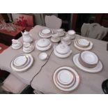 A Royal Doulton "Clarendon" part dinner service including lidded tureens, meat dish and saucers,