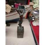 A bronze figure depicting semi-clad maiden with arms aloft, signed "Milo", with J.B.