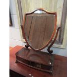 A mahogany shield form dressing table mirror with two drawers